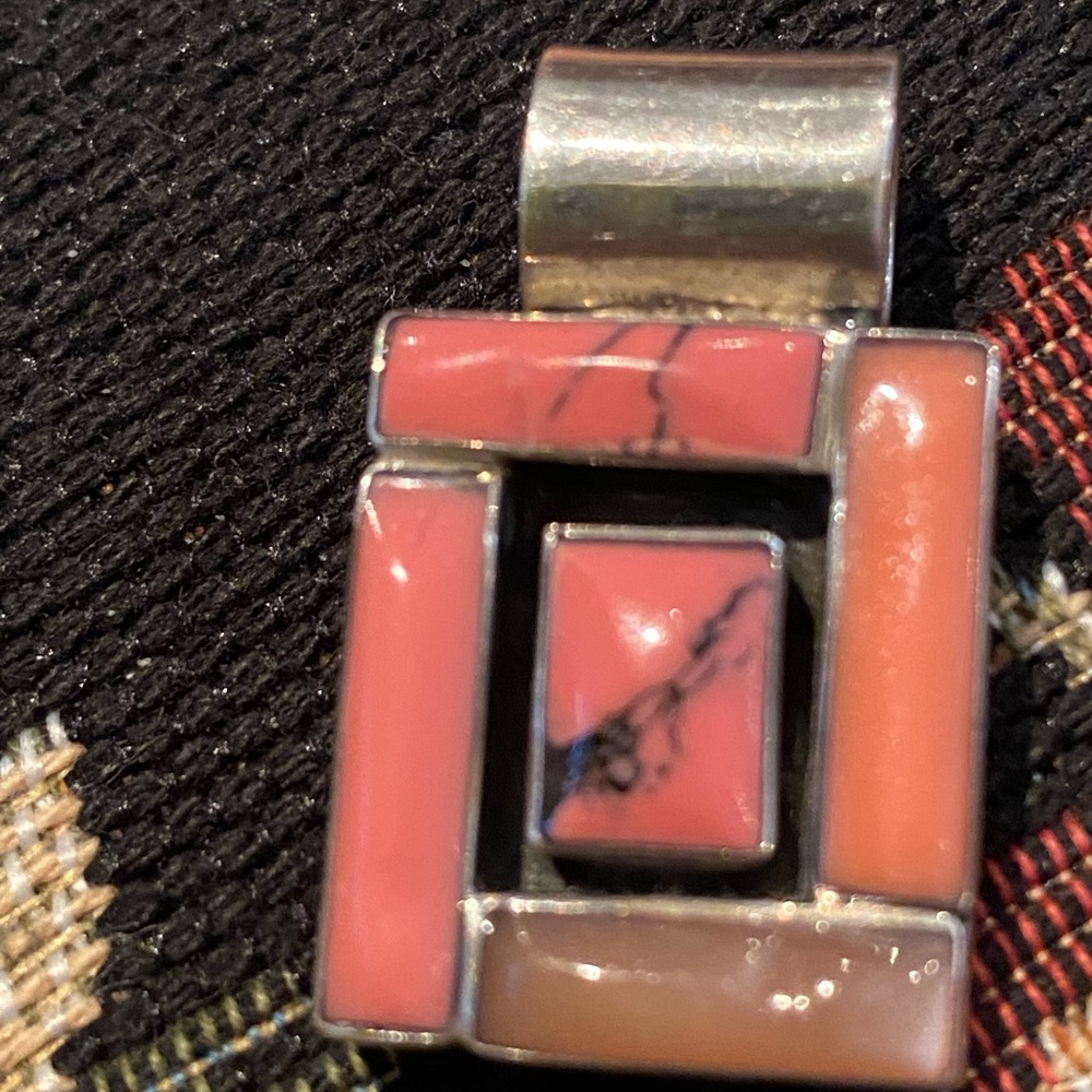 Beautiful pink coral .75” x 1.25” sterling silver pendant